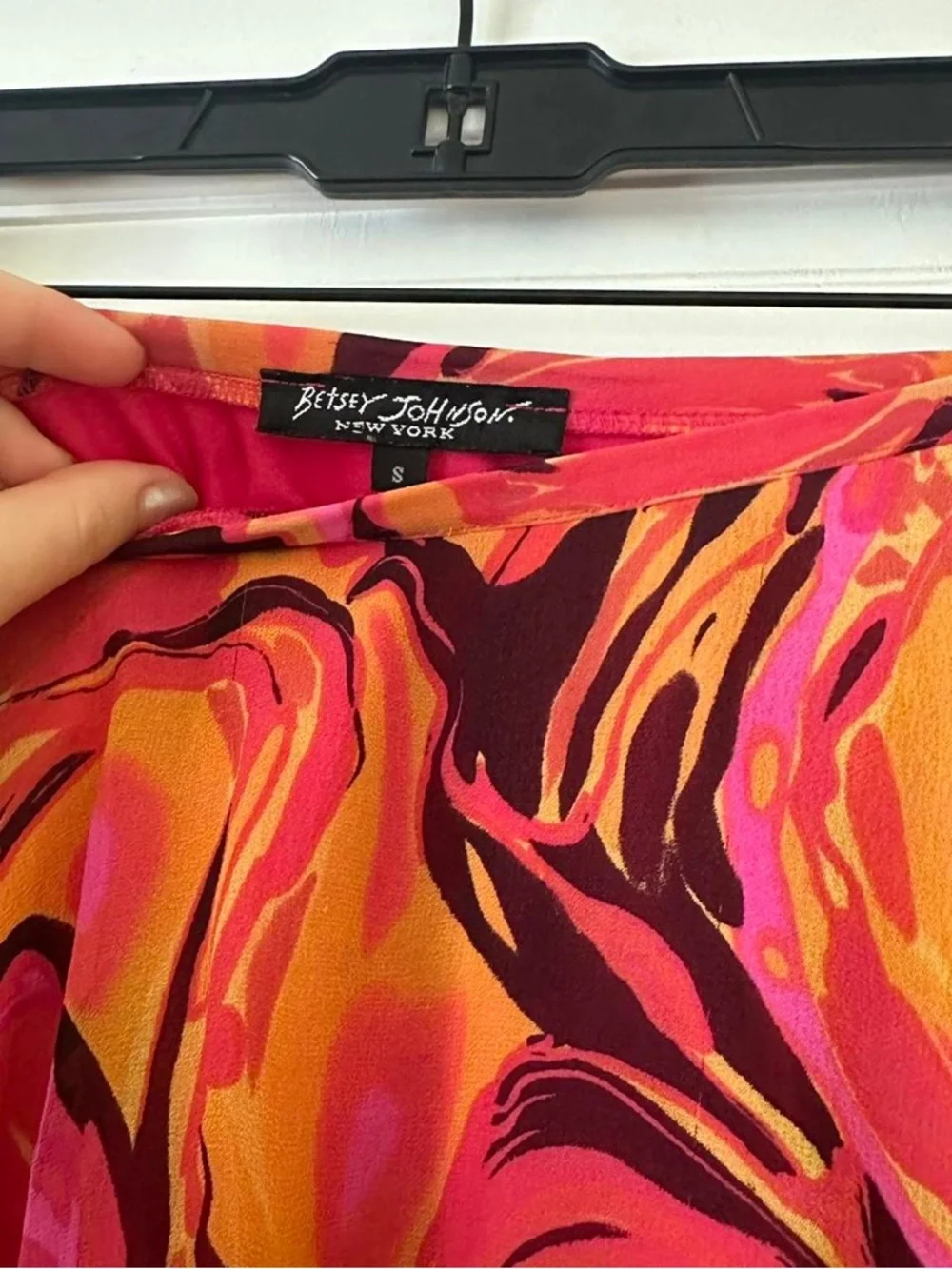 Betsey Johnson black label vibrant orange and pink swirl patterned silk skirt.